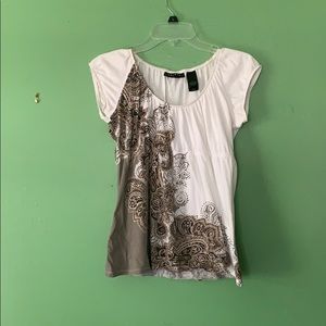 White top with cute design.